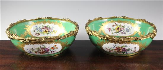 A pair of Sevres porcelain green ground bowls, c.1773, diameter incl. mounts 24cm (9.5in.), some decoration possibly later